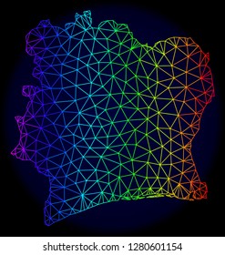 Rainbow colored mesh vector map of Ivory Coast isolated on a dark blue background. Abstract lines, triangles forms map of Ivory Coast. Carcass model for patriotic purposes.