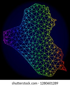 Rainbow colored mesh vector map of Iraq isolated on a dark blue background. Abstract lines, triangles forms map of Iraq. Carcass model for political posters. Polygonal model has bright rainbow colors.