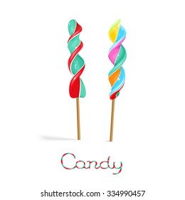Rainbow corkscrew lollipop candy on the stick isolated on white background