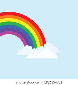 rainbow covered by clouds in blue sky