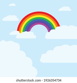 rainbow covered by clouds in blue sky
