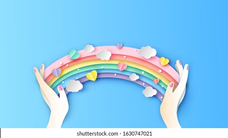 Rainbow in girl's hand is decorate with colorful hearts and clouds. Rainbow design for Valentine's day. paper cut and craft style. vector, illustration.