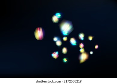 Rainbow highlights on a black background.Glare or reflection from water and glass.Glittering  particles for social media backgrounds, product presentations, photo shots.