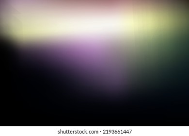 Rainbow highlights on a black background.Glare or reflection from water and glass.Glittering  particles for social media backgrounds, product presentations, photo shots.