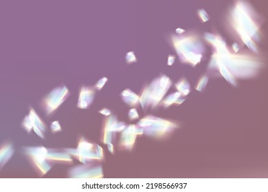 Rainbow highlights on a black background.Glare or reflection from water and glass.Glittering  particles for social media backgrounds, product presentations, photo shots.