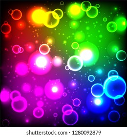 Rainbow neon color bright bubbles, abstract multicolor background with circles, sparkles and bokeh.