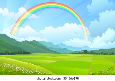 Rainbow over the mountains, hills and rice fields