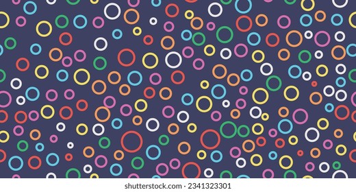 Rainbow rings. A pattern of round rings that are randomly placed on a blue background. Wallpaper from colored rainbow rings. Seamless vector print for textiles, pillows, clothes, etc.