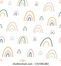 Rainbow seamless pattern. Unique hand drawn rainbow texture. Cute kids nursery background in pastel colors. Baby shower. Lovely cartoon rainbows for wallpaper, fabric, apparel. Vector illustration.