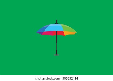 rainbow umbrella on green background