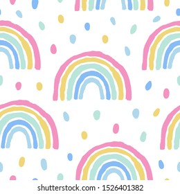 Rainbows and dots cute seamless pattern on white background.Hand drawn pastel print with simple shapes in scandinavian style. Design for nursery, textile,fabric,wallpaper etc
