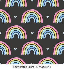 Rainbows and hearts cute seamless pattern on black background.Bright print with simple shapes in scandinavian style. Design for girls ,nursery,textile,fabric,wallpaper etc
