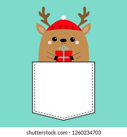 Raindeer deer head face holding gift box. T-shirt pocket. Red hat, nose, horns. Merry Christmas. Hapy New Year. Cute cartoon kawaii baby character. Funny animal. Flat design. Blue background. Vector
