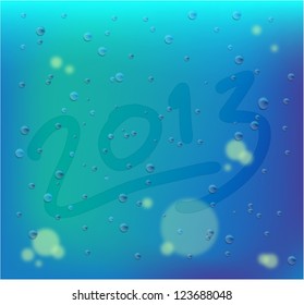 Raindrop on windows glass with drawing 2013