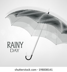 Conceito de Dia Chuvoso com guarda-chuva aberto sobre fundo cinza. 