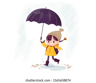 Rainy day. Little girl with umbrella running in the rain wearing, dressed a jacket, stepped in puddle.