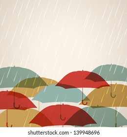 Rainy season background with raindrops and umbrellas,