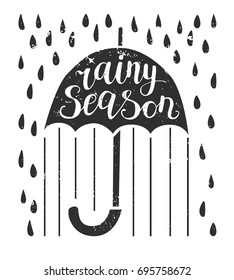 Rainy season. Vector illustration with lettering. Umbrella with hand written phrase, raindrops and grunge texture isolated on white background. Card and poster design.
