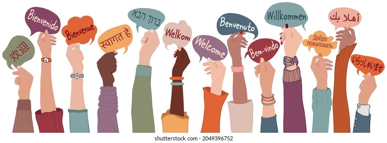 Raised arms and hands of multi-ethnic people from different nations and continents holding speech bubbles with text -Welcome- in various international languages.Communication. Community
