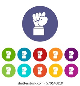 Raised up clenched male fist set icons in different colors isolated on white background