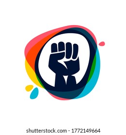 Raised Fist On Multicolored Paint Splash Logo. Negative Space Style Icon. Vector Sign Perfect To Use In Any Revolution Labels, Freedom Posters, Rebel Identity, Etc.