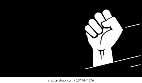 Raised hand clenched fist sign, isolated on a black background with copy space. Black history month. Freedom, solidarity and liberty protest symbol.
