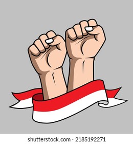 Raised hands fist wrapped in the Indonesian flag