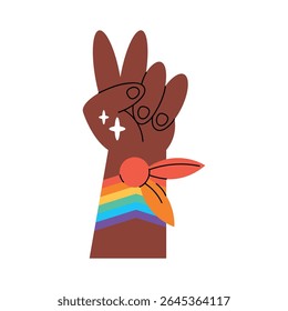 Raised rainbow fist symbolizing LGBTQ pride and resistance
