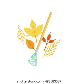 Rake And Fallen Leaves As Autumn Attribute