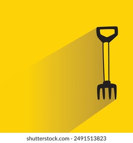 rake icon with shadow on yellow background