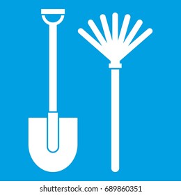 Rake and shovel icon white isolated on blue background vector illustration