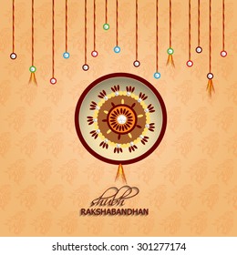 Raksha bandhan greeting card or illustration with beautiful Rakhi.
