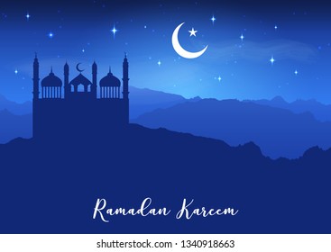 Ramadan Kareem background with mosque silhouettes against a night sky