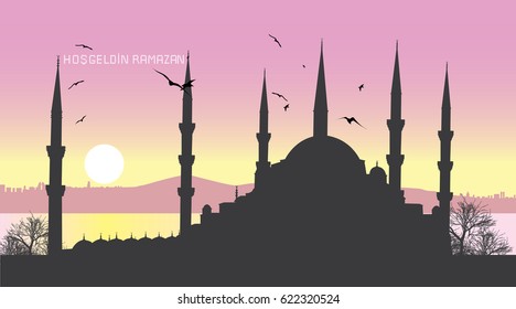 Ramadan Kareem. Background for your greeting card with Istanbul city and Suleymaniye mosque silhouette. Translation of title in image: Welcome Ramadan month.