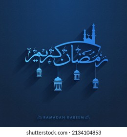 Ramadan Kareem Calligraphy In Arabic Language With Silhouette Mosque, Hanging Lanterns On Blue Background.