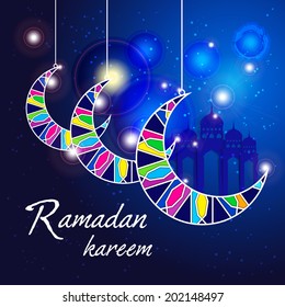 Ramadan Kareem greeting card / Vector template greeting card with crescent moon / Colorful crescent moon on blue background 