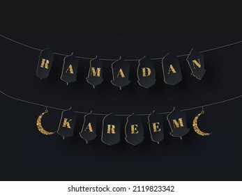Ramadan Kareem Letter Garland With Golden Crescent Moon Hang On Black Background.