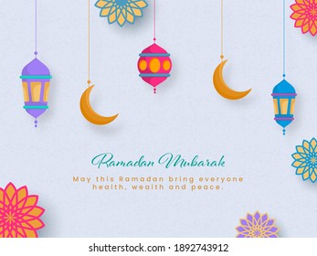 Ramadan Mubarak Font With Hanging Lanterns, Crescent Moon And Islamic Pattern Decorated On Pastel Blue Background.