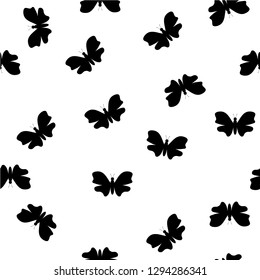 Random black and white butterflies pattern on white background