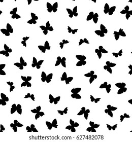 Random black and white butterflies silhouettes pattern. 