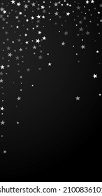 Random falling stars Christmas background. Subtle flying snow flakes and stars on black background. Alluring winter silver snowflake overlay template. Amusing vertical illustration.