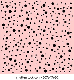 Random pattern of different size black polka dots on faded pink background. Vector illustration.