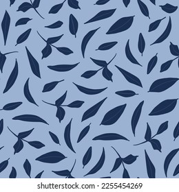 Random placed leaves seamless repeat pattern. Vector, botanical elements all over surface print on blue background.