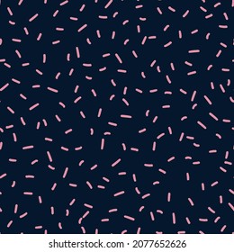 Random placed vector strokes seamless repeat pattern. Short lines all over minimal print on dark blue background.