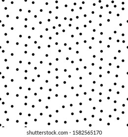 Random scattered dots, abstract black and white background. Seamless vector pattern. Black and white polka dot pattern. Celebration confetti background. Vector EPS 10