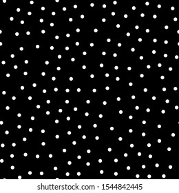 Random scattered polka dot pattern, abstract black and white background, white dots on black. Seamless vector pattern. Black and white polka dot pattern. Celebration confetti background.