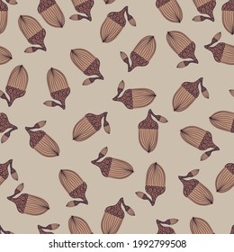 Random seamless hand drawn pattern with doodle beige acorn ornament. Grey background. Nature artwork. Vector illustration for seasonal textile prints, fabric, banners, backdrops and wallpapers.