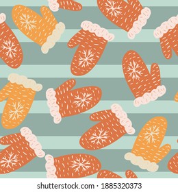 Random seamless pattern with red and orange warm mittens. Blue striped background. Vector illustration for seasonal textile prints, fabric, banners, backdrops and wallpapers.