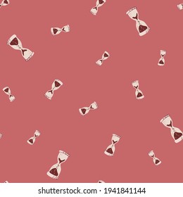 Random seamless pattern with simple style hourglass ornament. Pink background. Pastel tones backdrop. Vector illustration for seasonal textile prints, fabric, banners, backdrops and wallpapers.