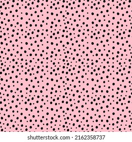 Random small black polka dot background. Print with irregular chaotic points. Vector seamless hand drawn pattern for design, textile, wrapping paper, scrapbooking.